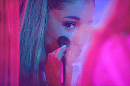 Ariana Grande doing makeup in the mirror