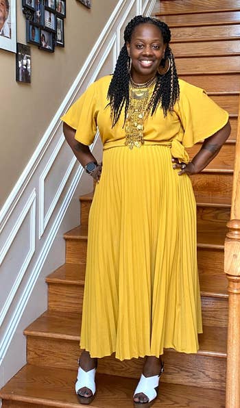 reviewer in the tie waist yellow dress with short sleeves