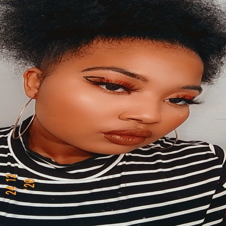 reviewer selfie with graphic eyeliner wearing the foundation