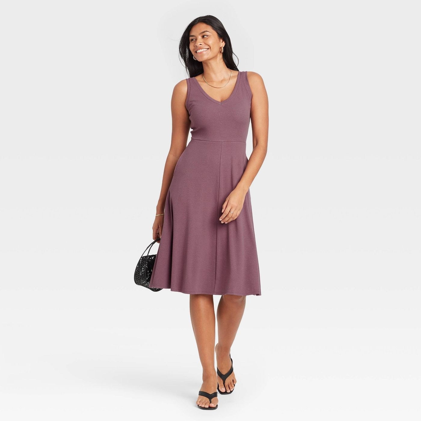 A model wearing a plum tank dress