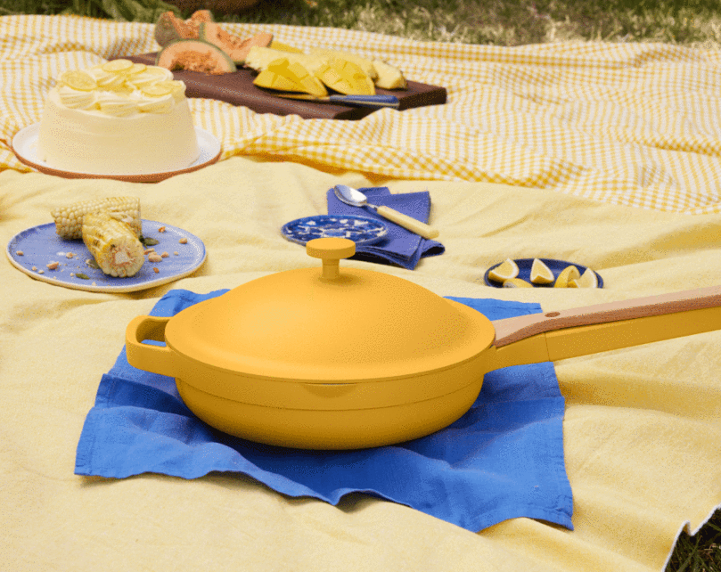 the yellow always pan on a picnic blanket