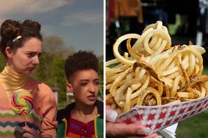 Two girls are at a carnival on the left with a woman holding fries on the right