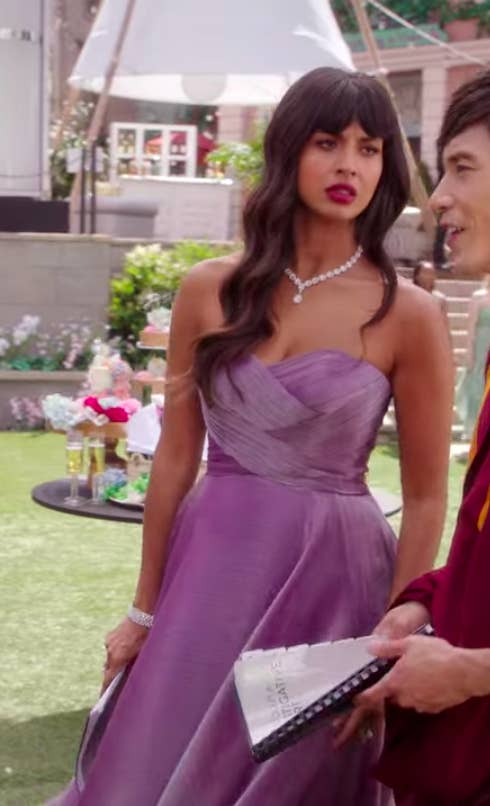 Tahani wearing a strapless gown
