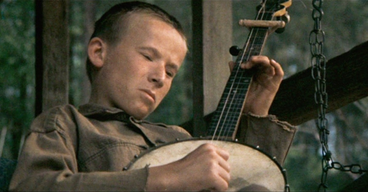 Kid plays the banjo