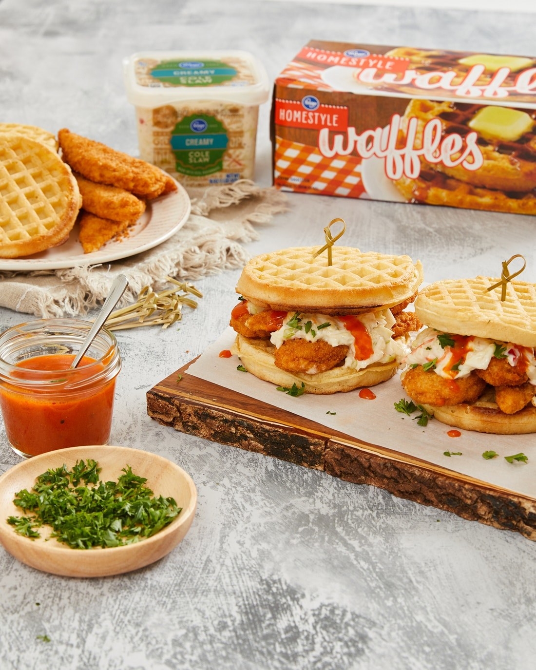 Chicken tender and waffle sandwiches on a serving platter