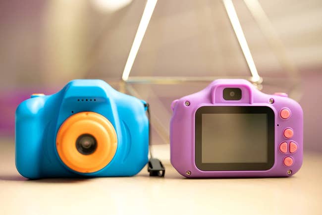 Reviewer's photo of toy cameras in blue and purple