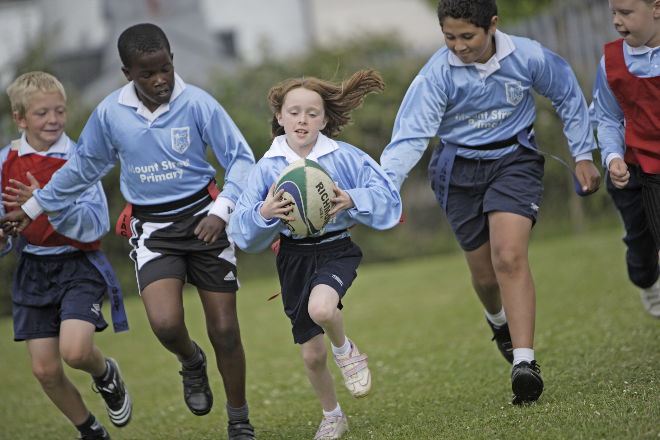 Children playing rugby at school