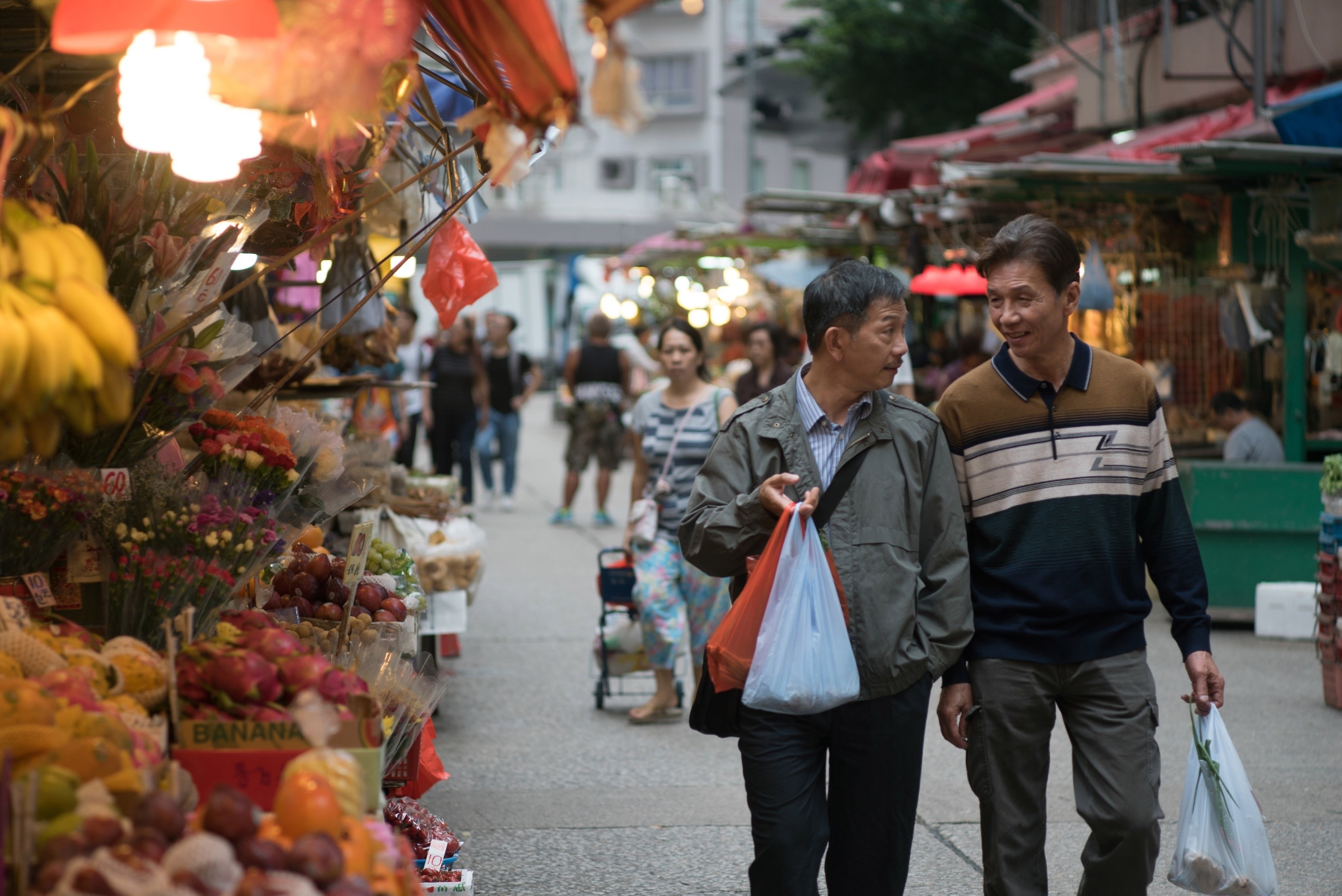 from left: Ben Yuen, Tai-Bo walking outside