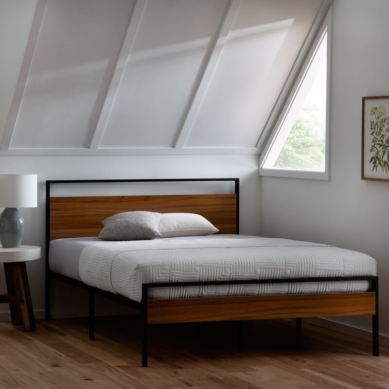 A  bedroom featuring the frame in brown