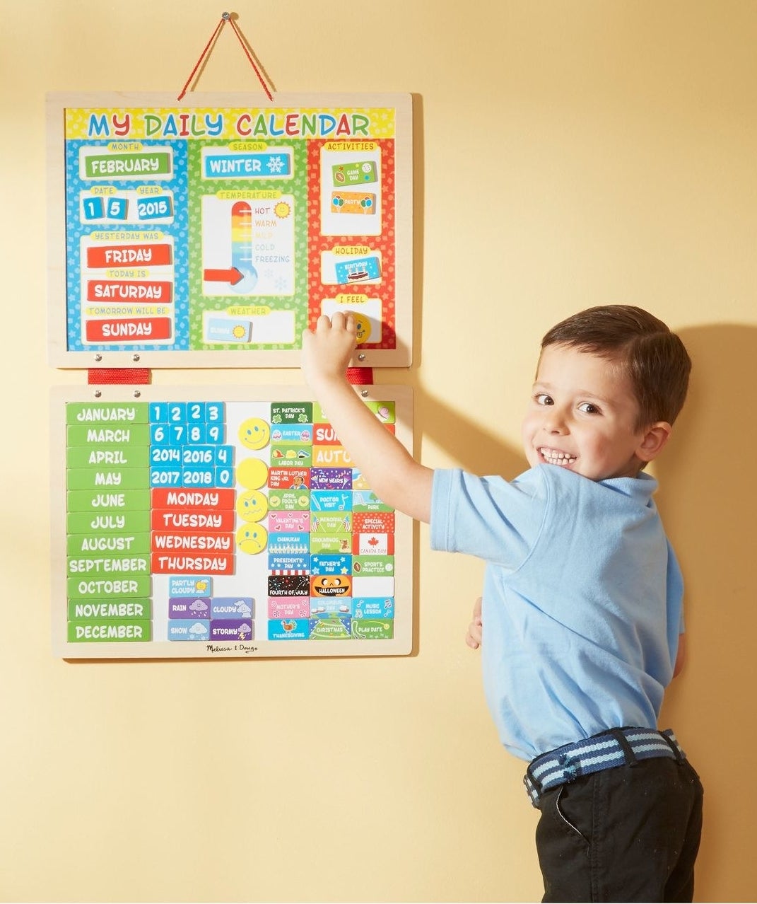 a child using the magnetic daily calendar