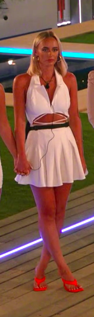 Millie wearing a sleeveless mini dress