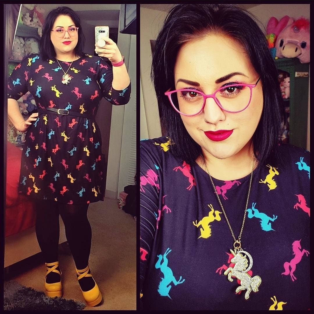Reviewer wearing the novelty unicorn black printed crew neck dress