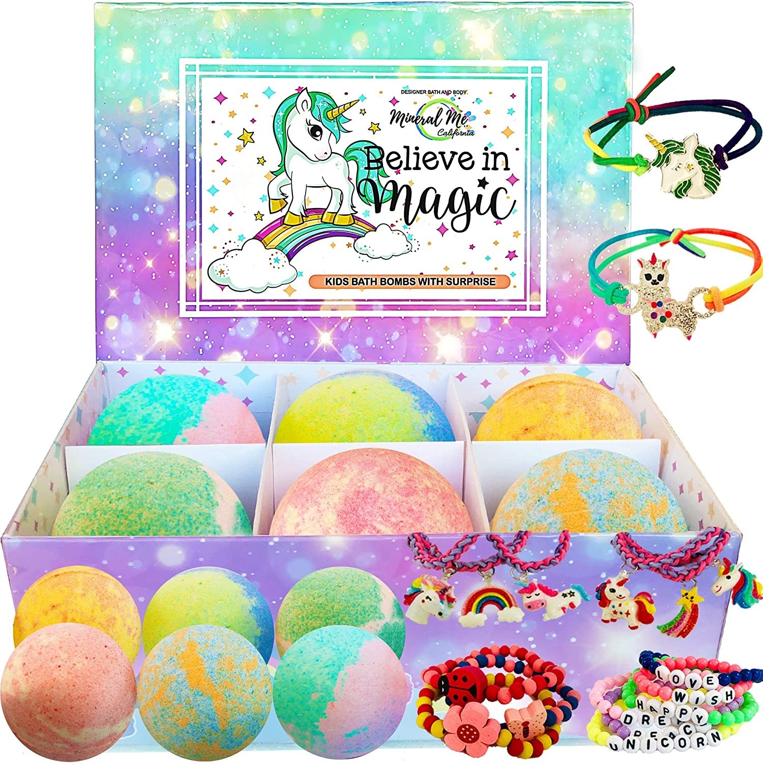 Six multicolored bath bombs in a box with a unicorn design and some bracelets