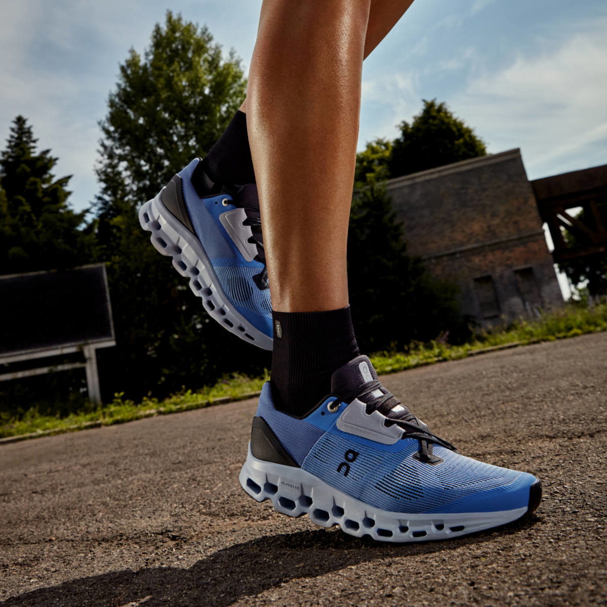 model running in the sneakers in blue