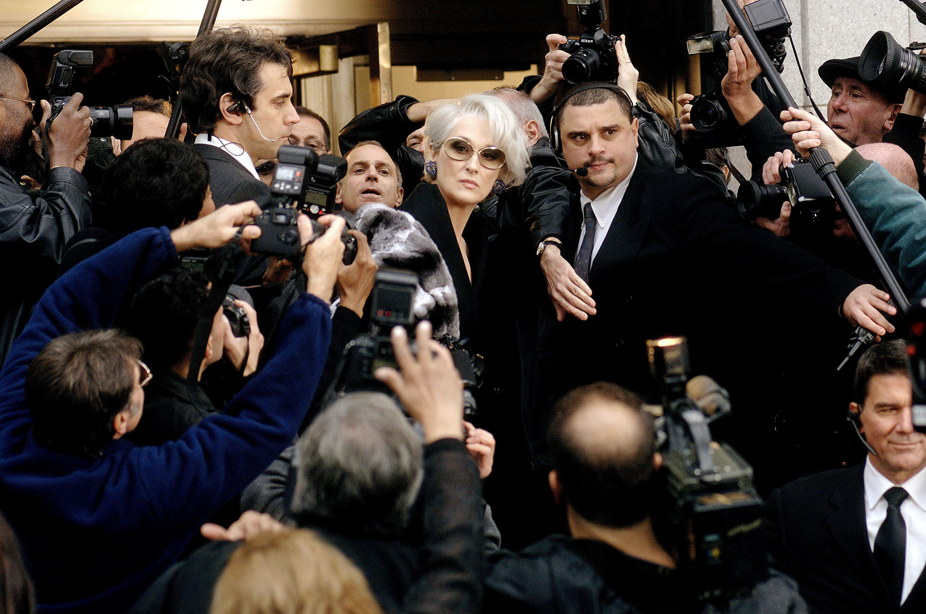 Miranda looks out across a sea of reporters looking for Andy