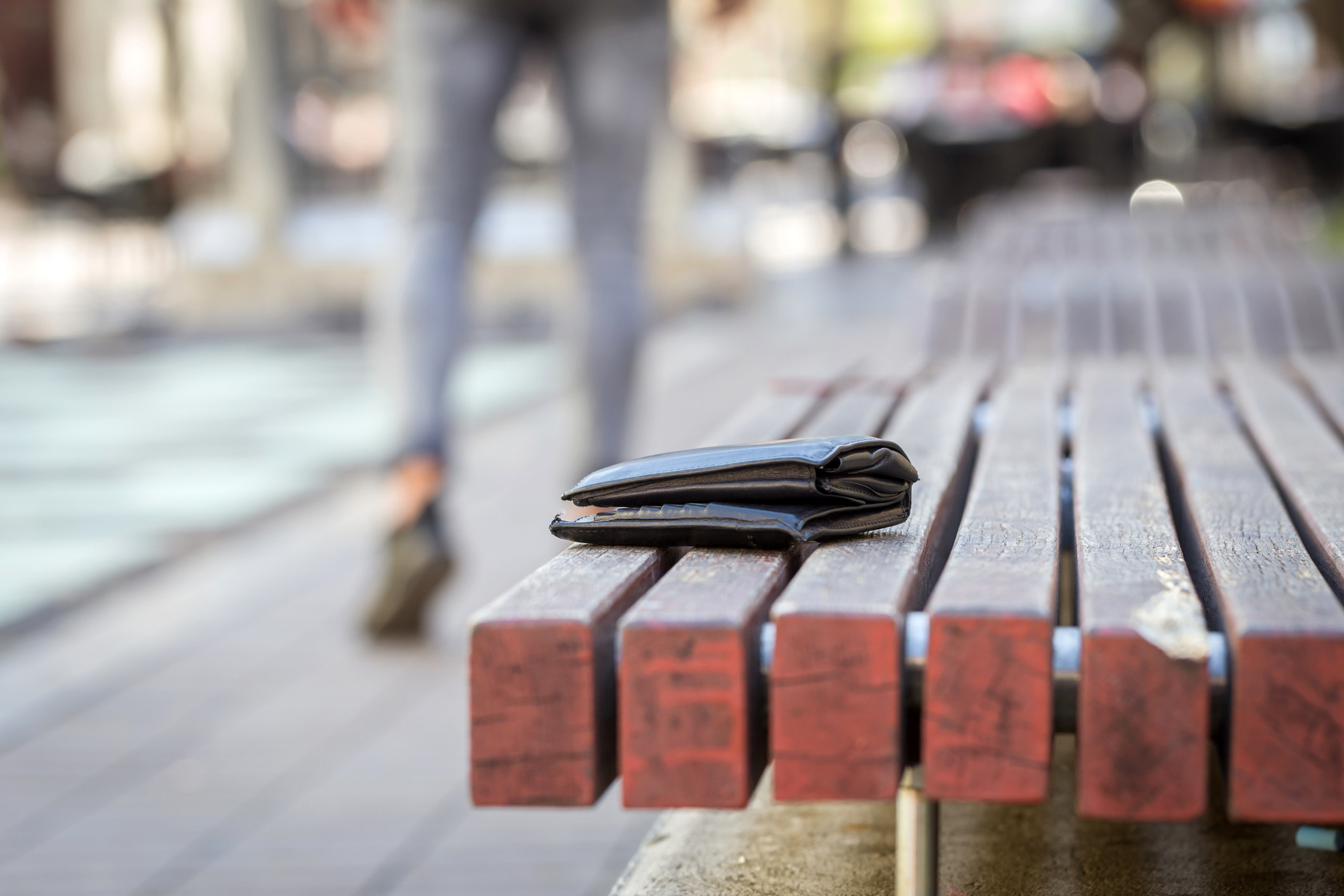 A lost wallet on a bench.