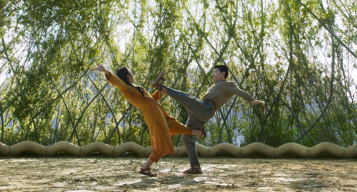 Ying Nan (Michelle Yeoh) and Shang-Chi (Simu Liu) in a bamboo forst