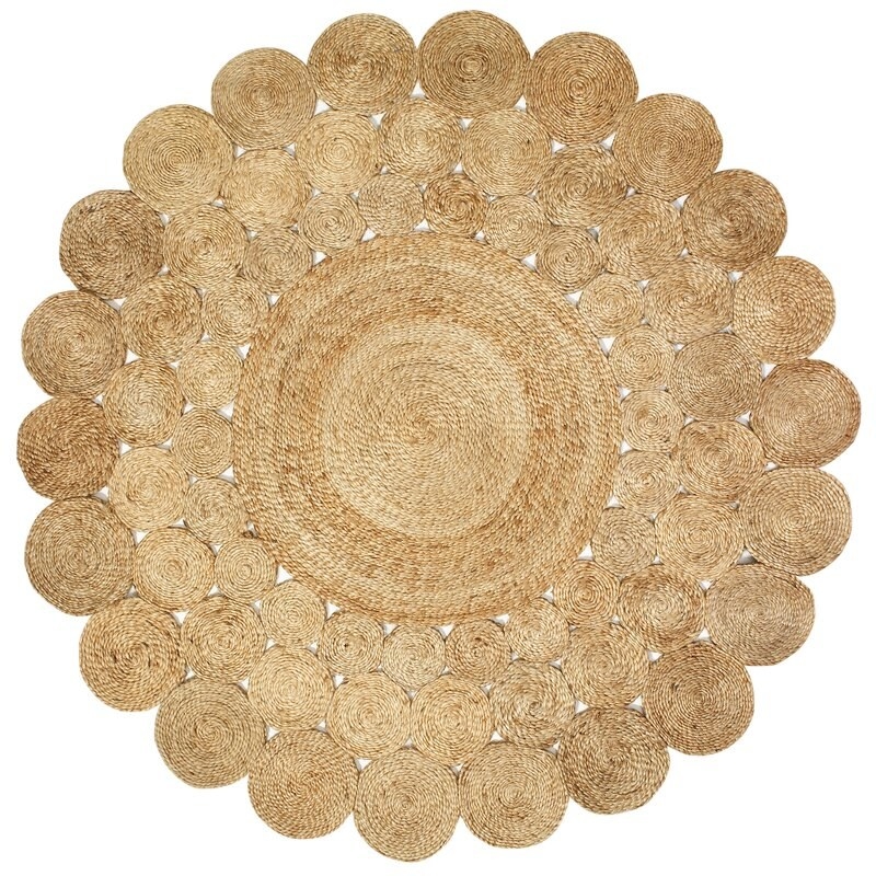 Round jute rug made up of one large circle in the middle and smaller circles going around.