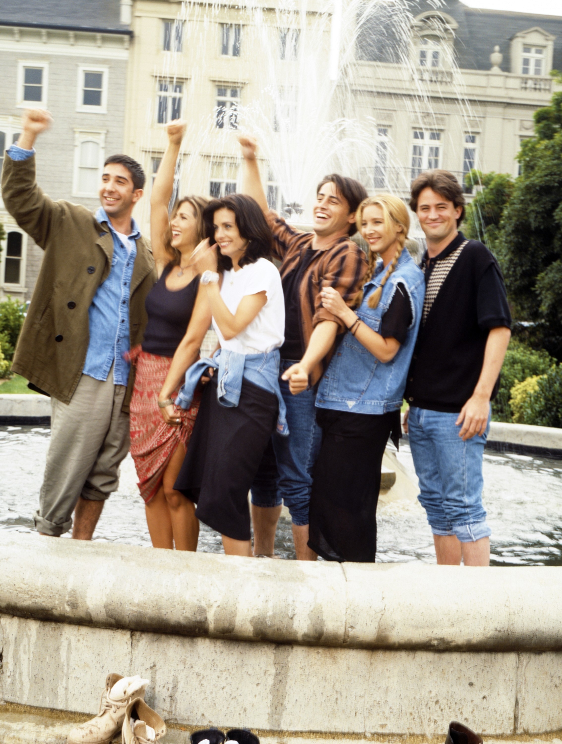 The cast of Friends standing in the fountain