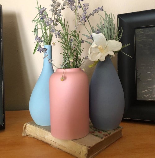 Reviewer's trio of vases are displayed on a book