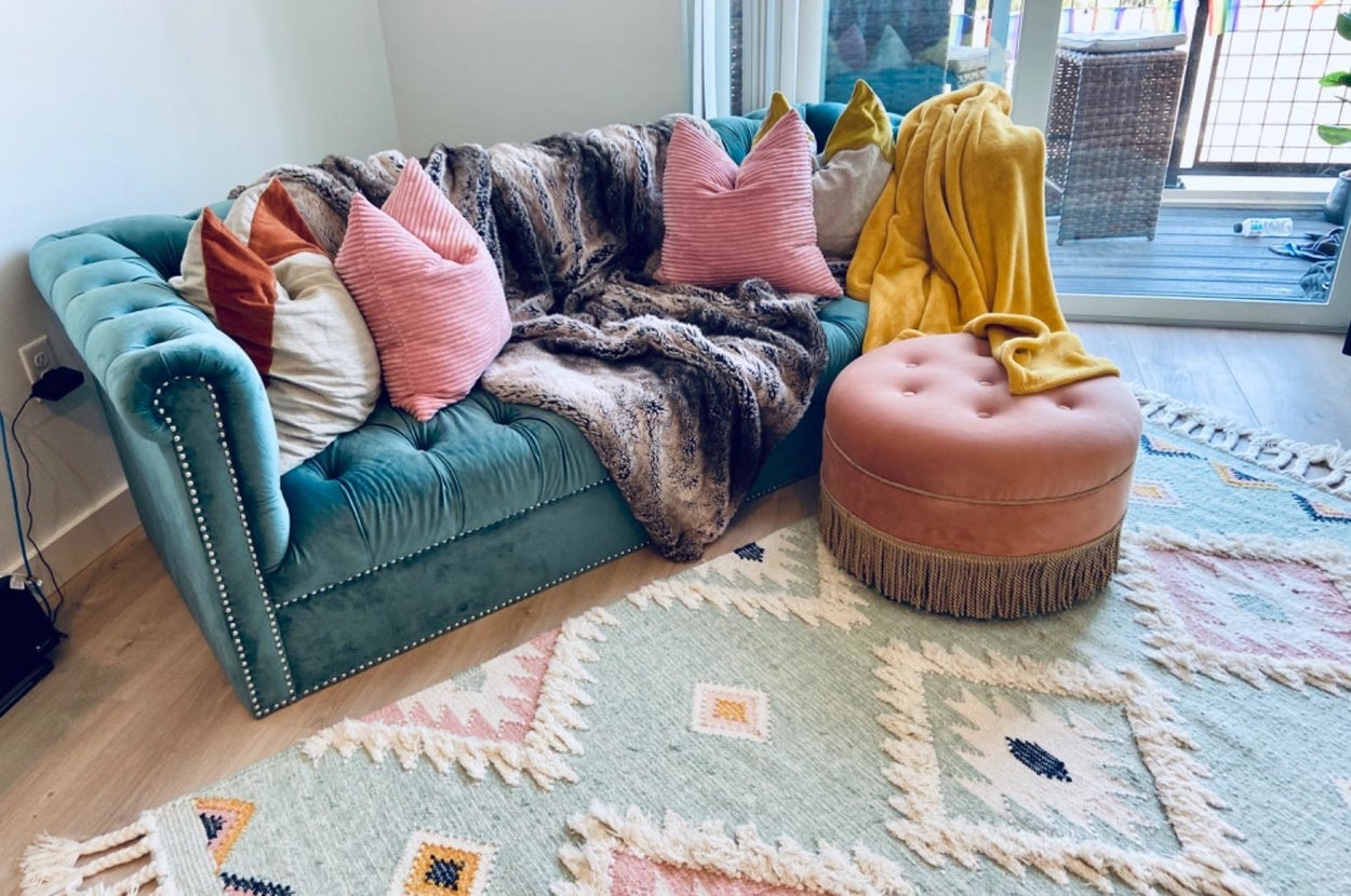 Reviewer's ottoman is shown in a living room