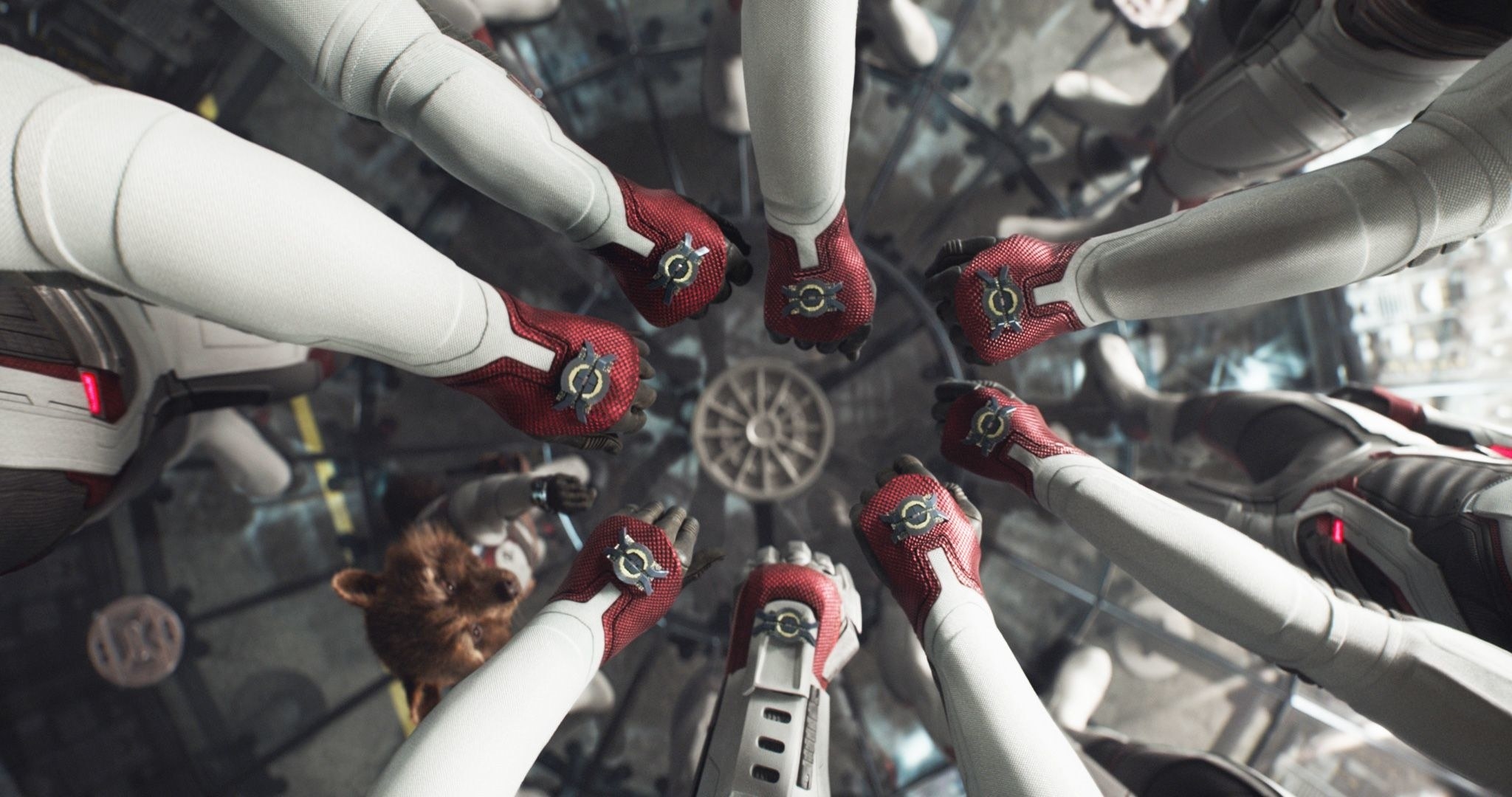 avengers have their hands in a cirlce like the power rangers