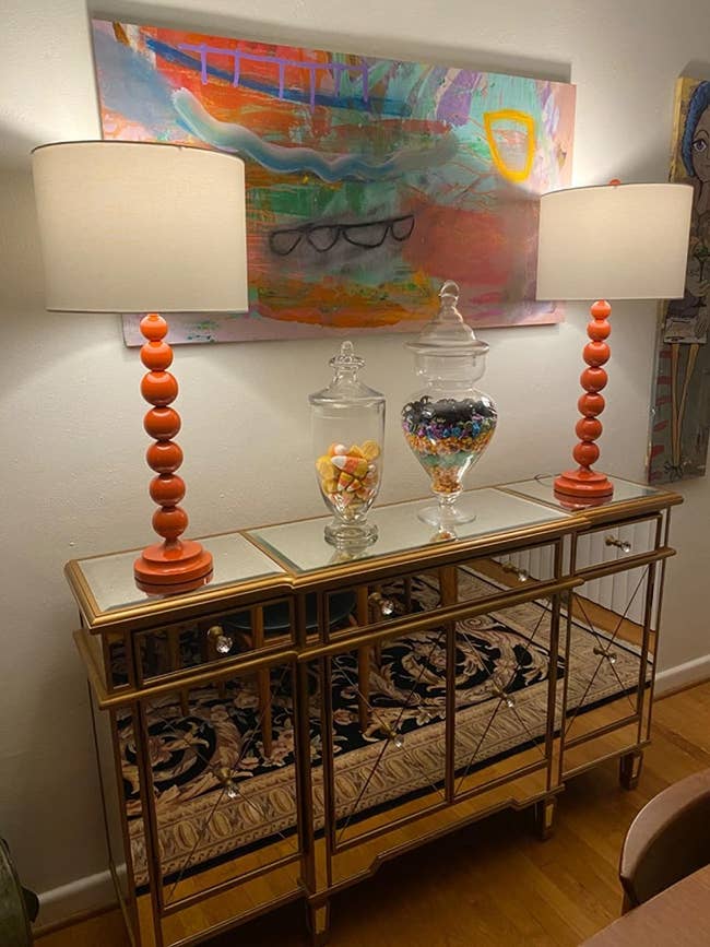 Reviewer's lamps sit on a mirrored console table