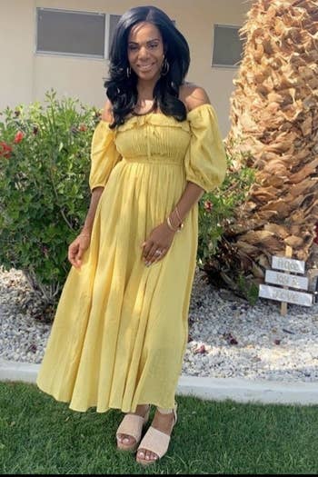 reviewer in yellow romantic-style maxi dress and wedges
