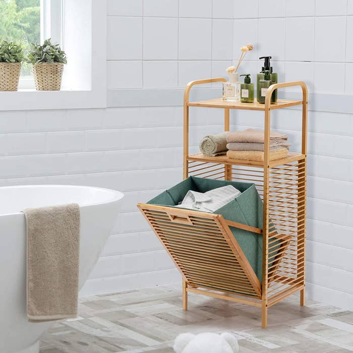 the tilt out laundry storage in a bathroom