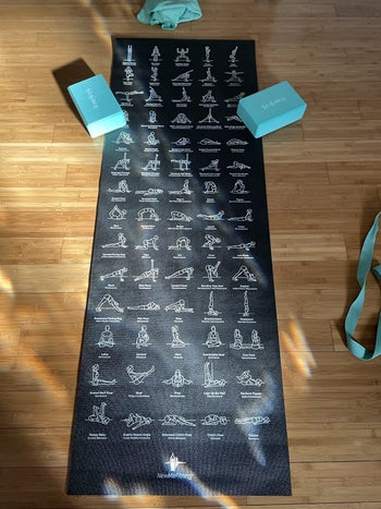 same yoga mat on floor with blue yoga blocks