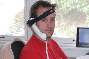 Man with phone receiver strapped to his head.