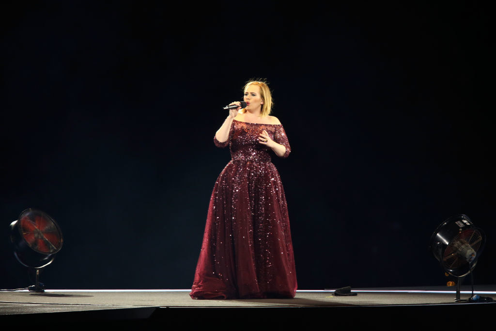 Adele performs in Australia in a floor-length gown