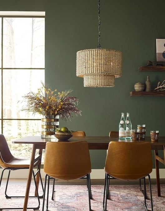 dining room with the two layer pendant lamp above the table