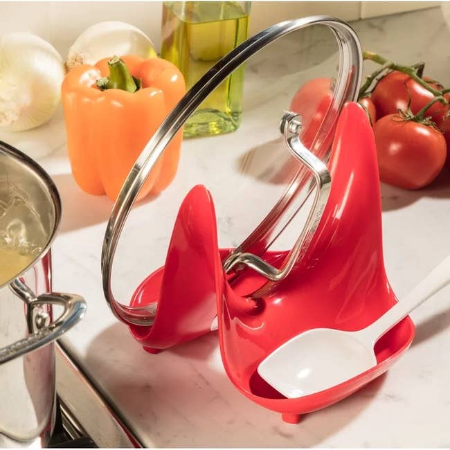 The lid and spoon remainder holding a lid and spoon connected a room counter