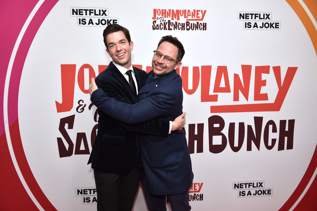 John and Nick Kroll hugging at an event for the Netflix show John Mulaney and the Sack Lunch Bunch