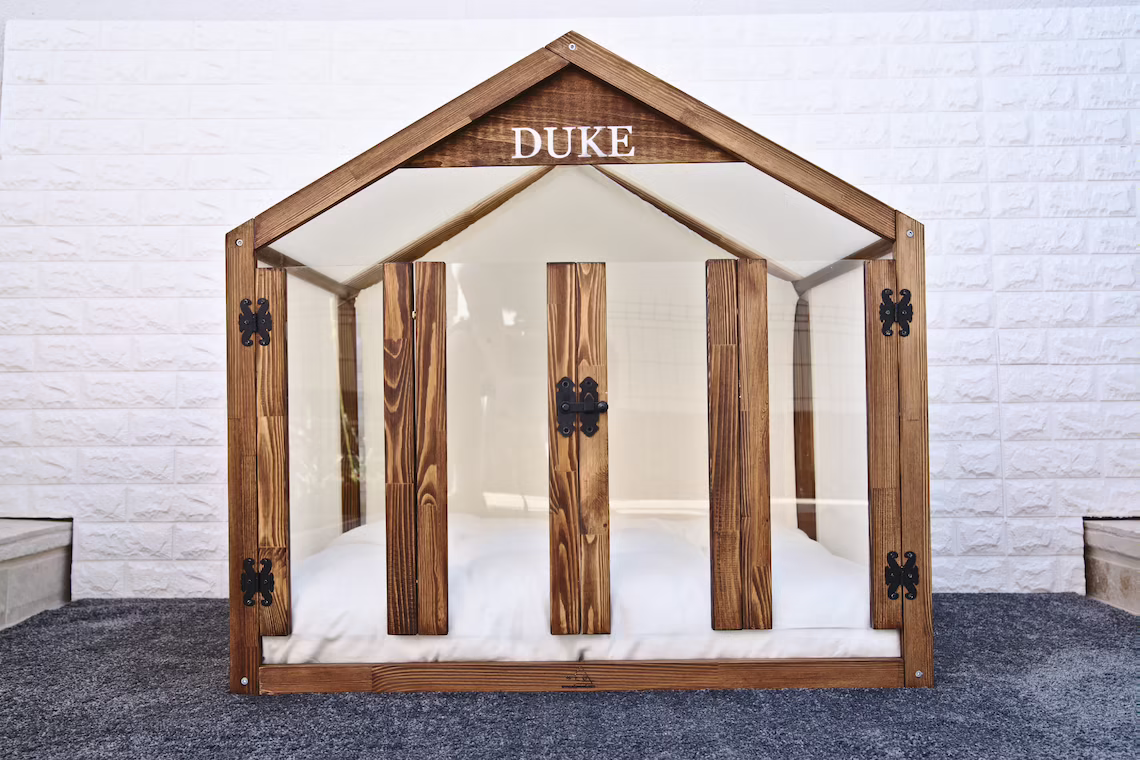 wooden dog house with doors and a bed