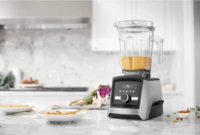 The Vitamix blender making soup on a kitchen counter
