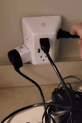 Reviewer turning the light on and off the charger with items plugged in 
