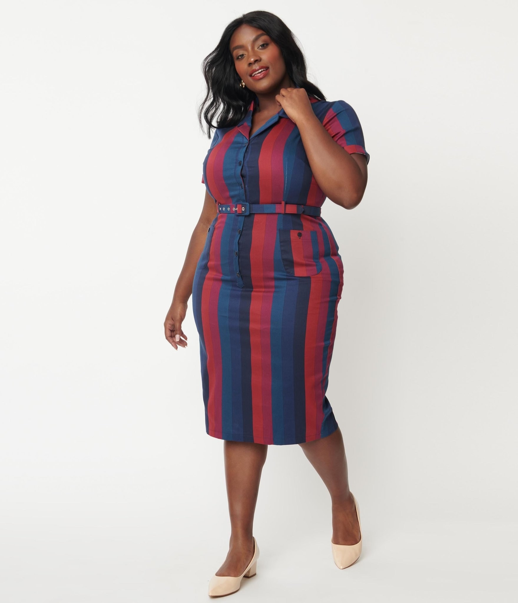 model in the midi blue, navy, red, and magenta vertical stripe belted short sleeve dress
