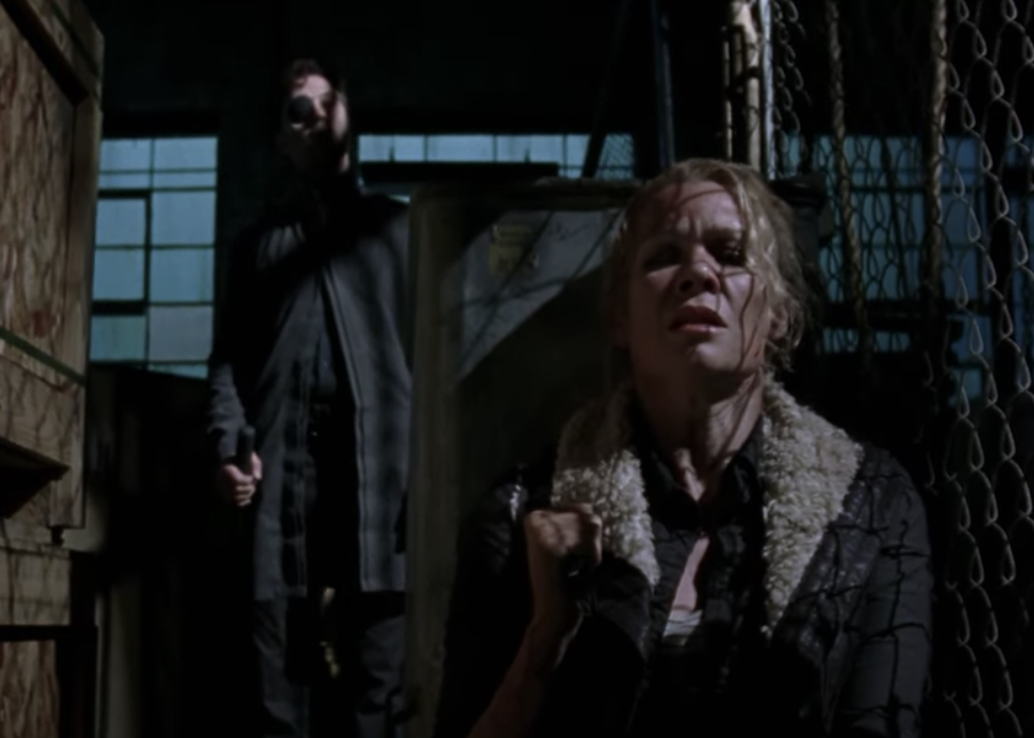 Andrea hiding with the Governor behind her