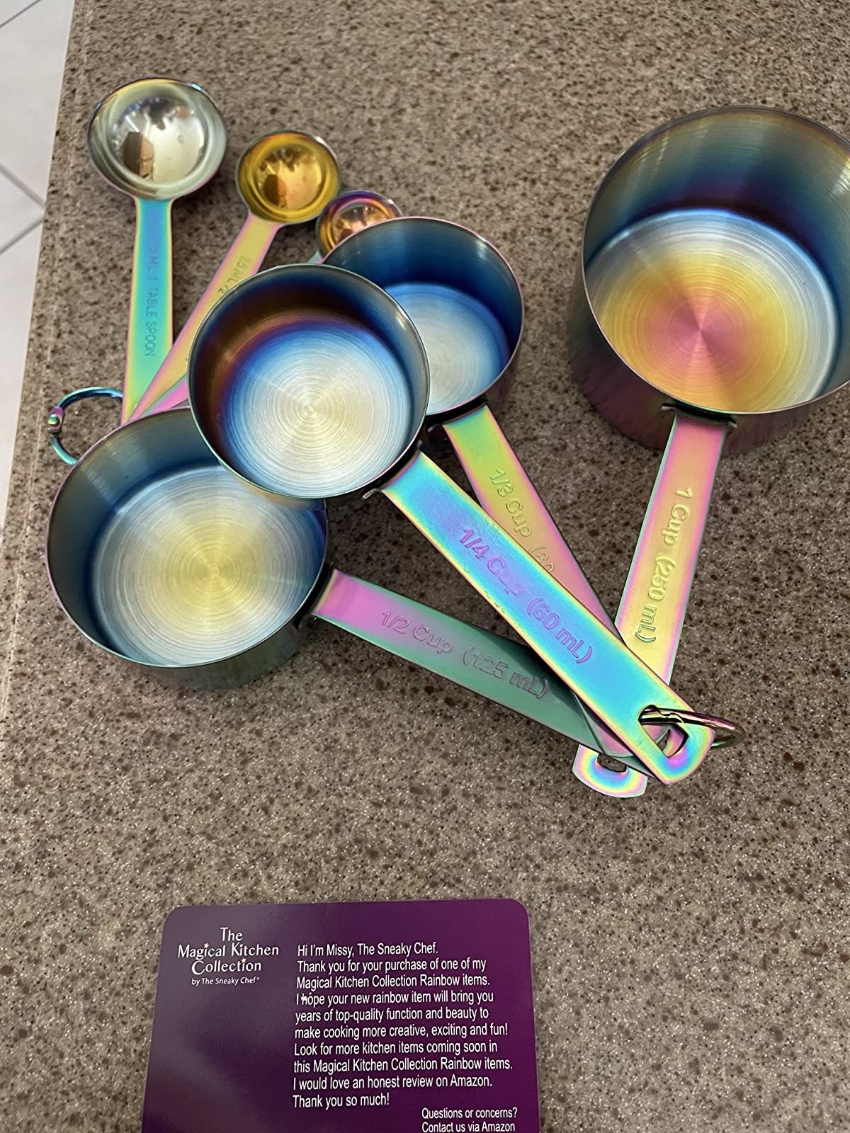 reviewer image of a set of iridescent measuring spoons