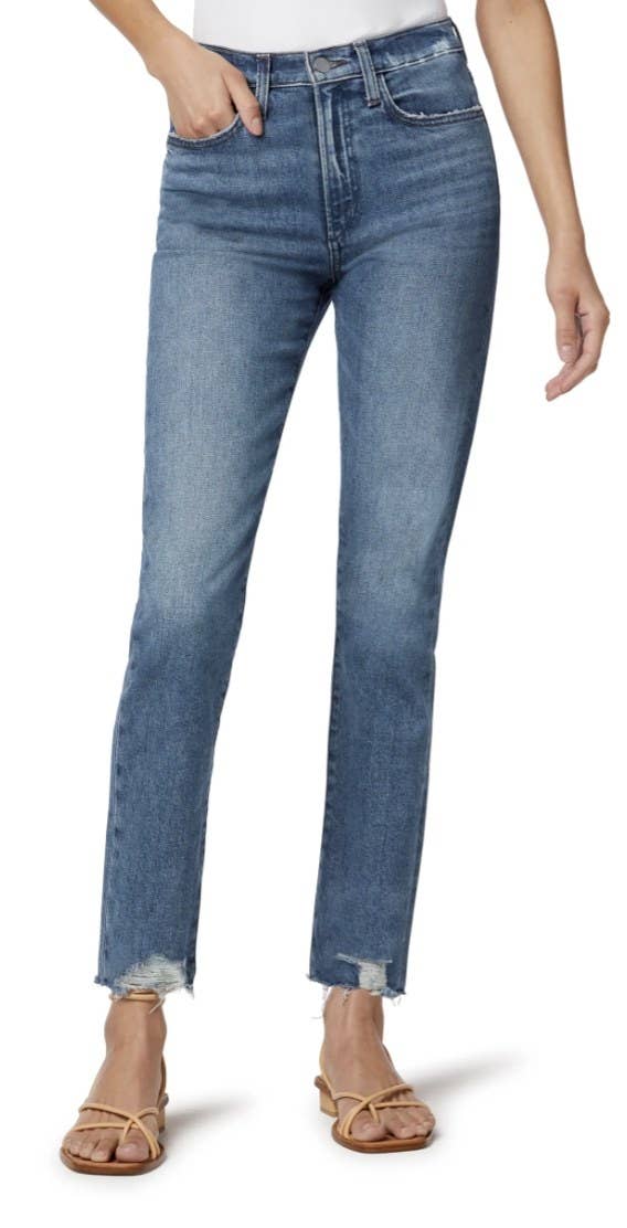 a model in blue jeans with a raw hem