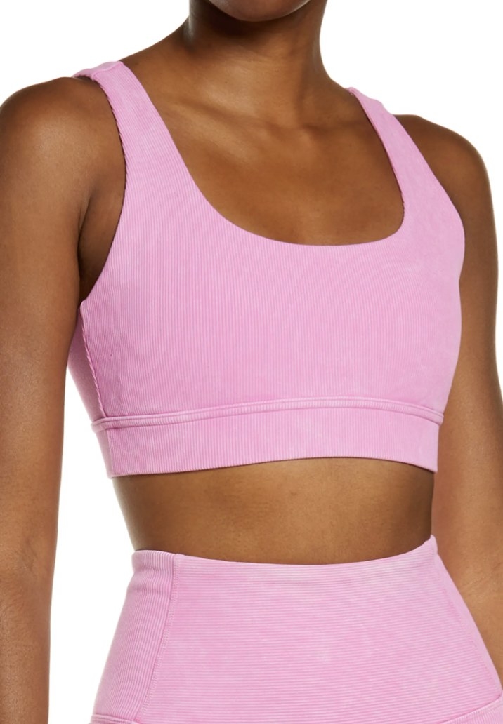 a person wearing the sports bra in pink