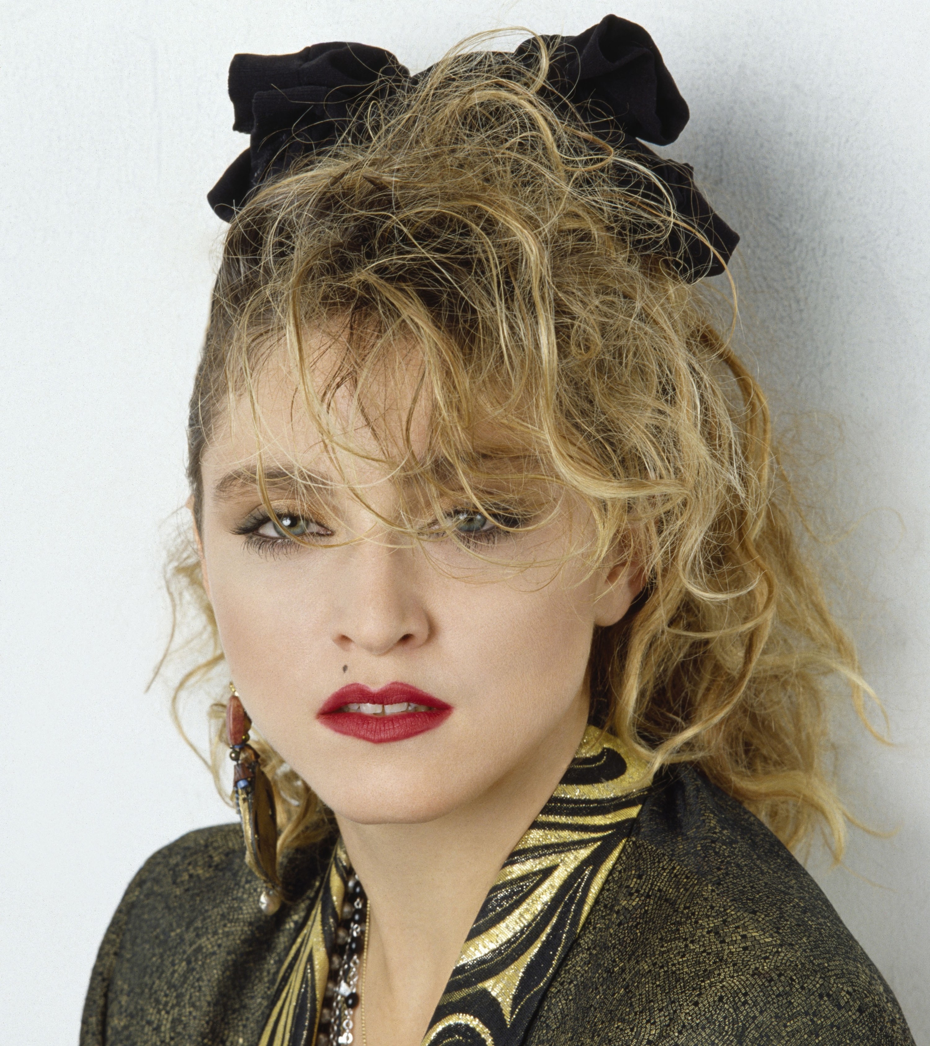 Close up photo of Madonna in red lipstick and black eyeliner
