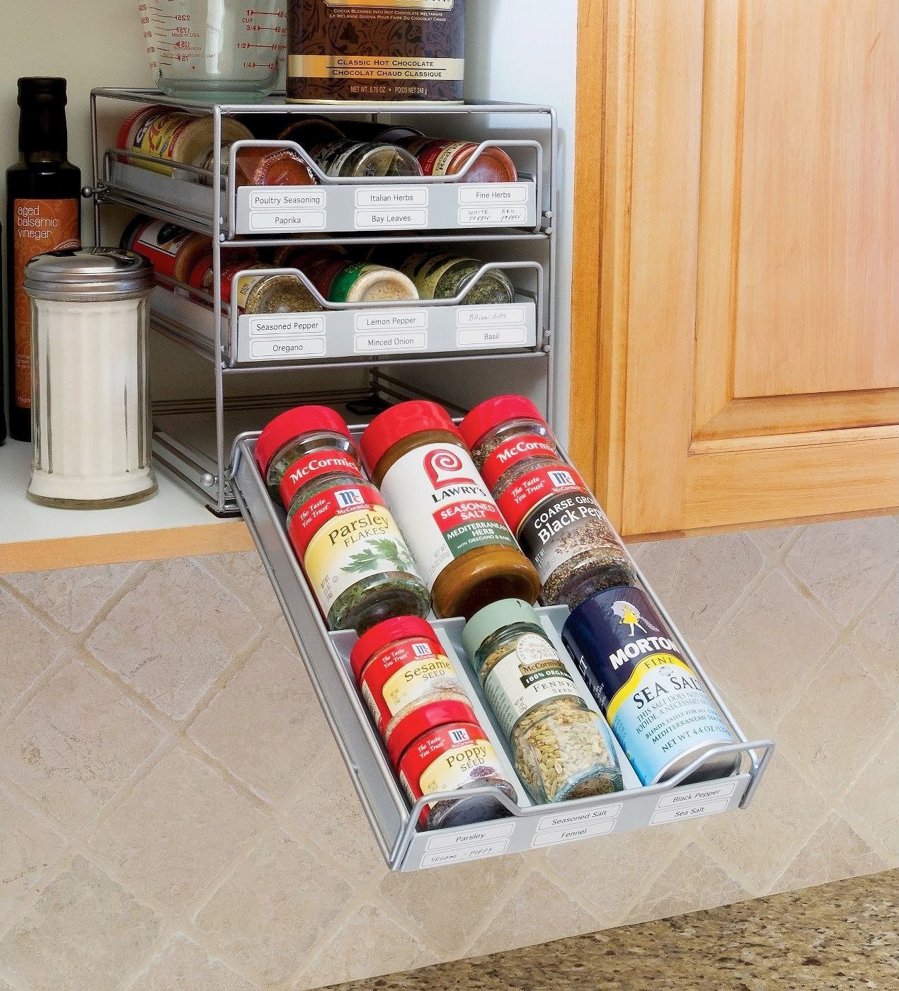 three-tier tilt down spice drawer filled with spice jars