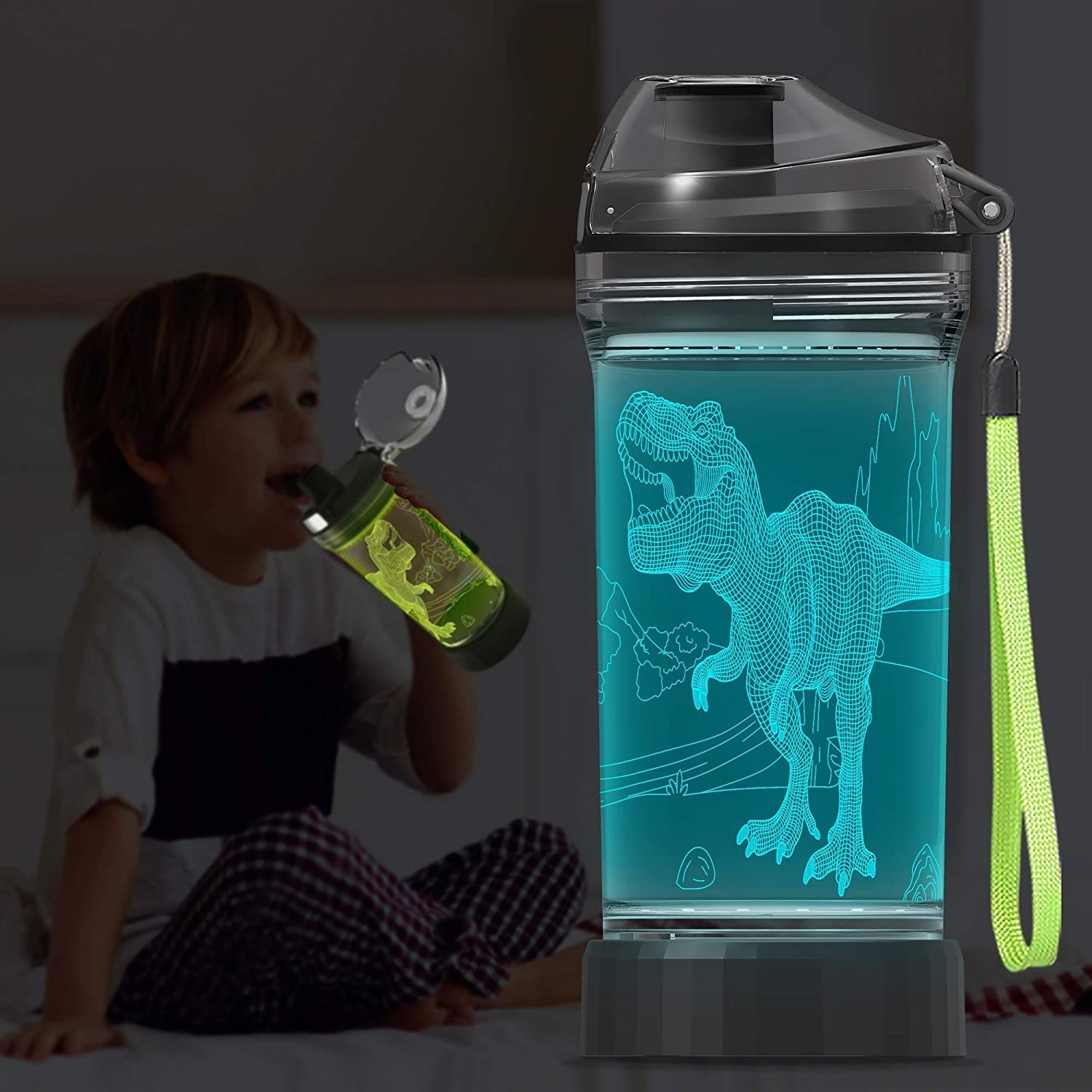 A child drinking from a green lit up dino cup near a teal lit up water bottle