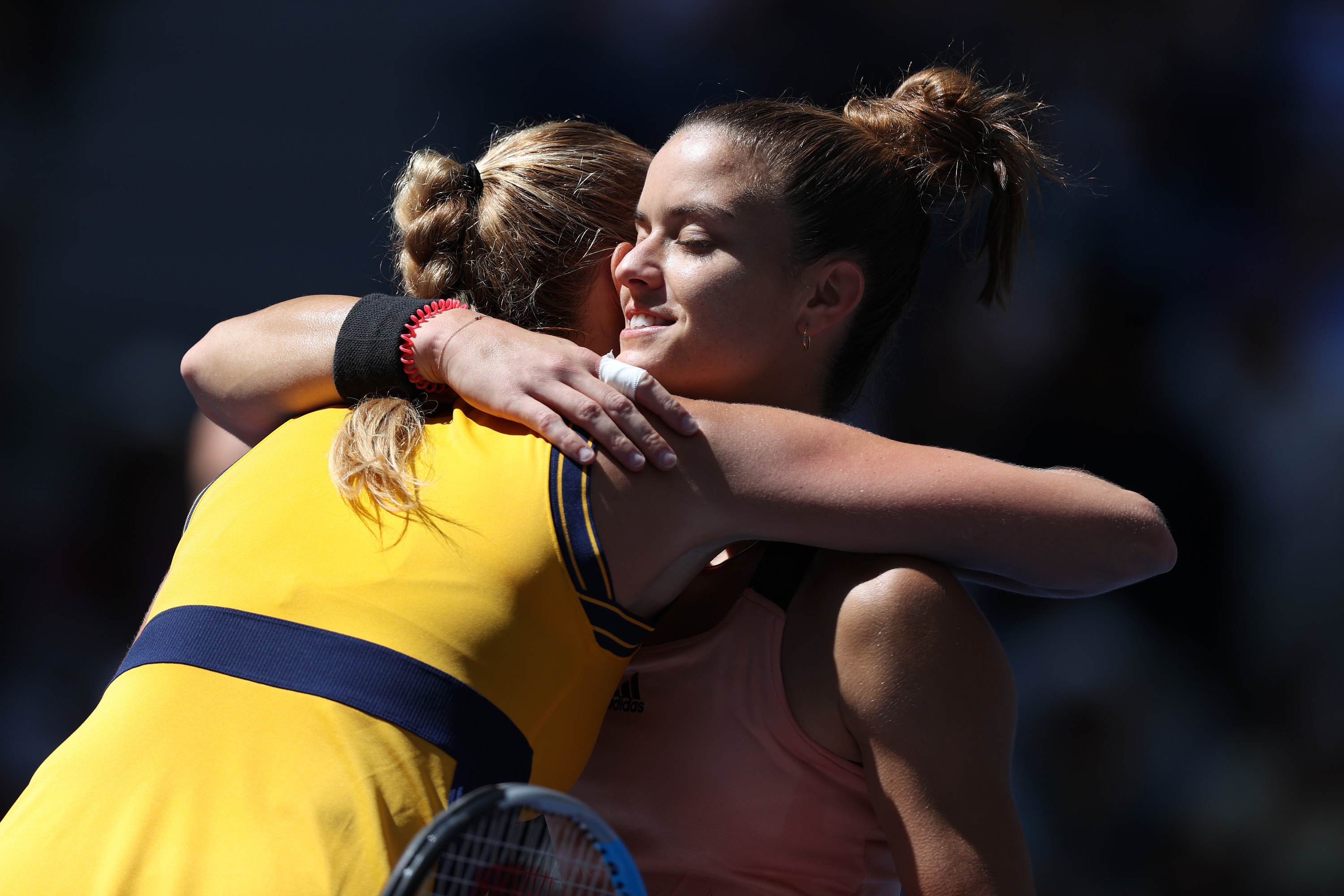 Maria Sakkari hugs Petra Kvitova after win