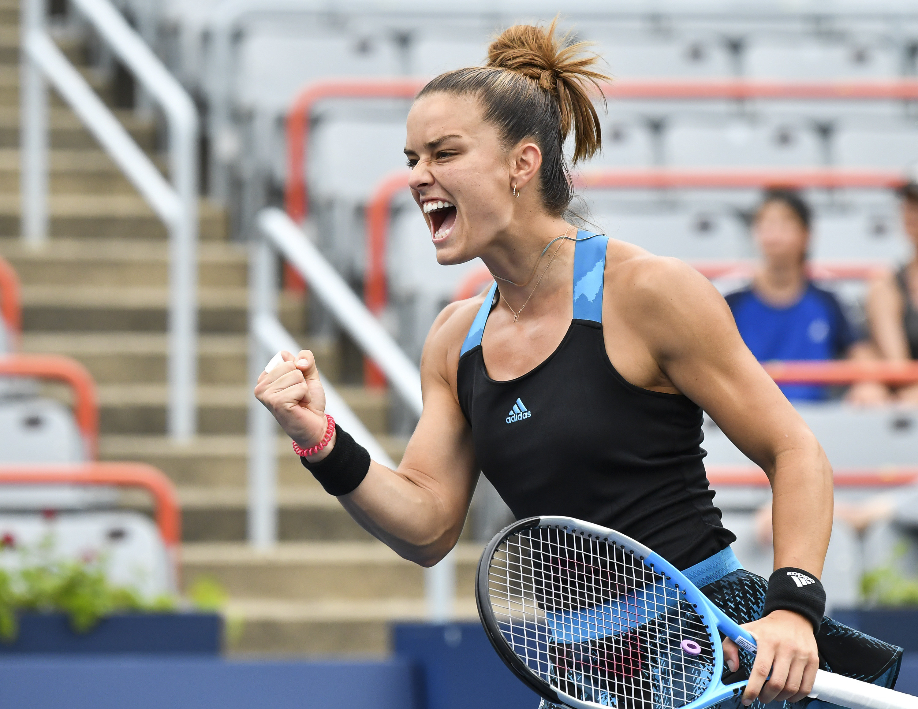 Maria Sakkari yells in celebration