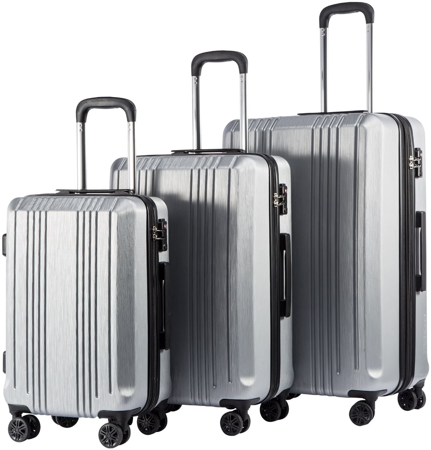 Three hard shell suitcases of various sizes