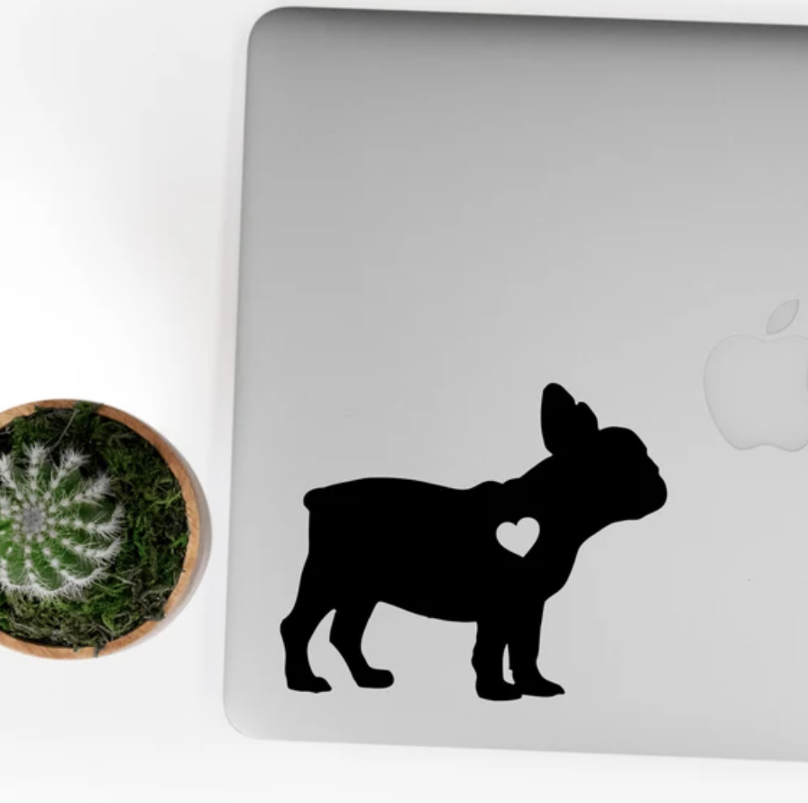 Frenchie-shaped sticker on Mac laptop